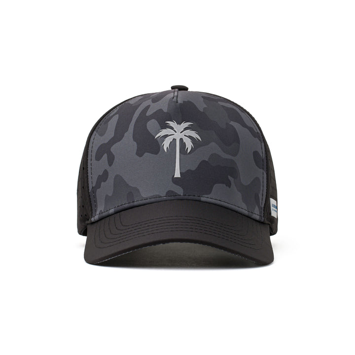 Front view of a black hat with a white palm tree logo, dark camo design, and water-repellent fabric for durability during active wear.