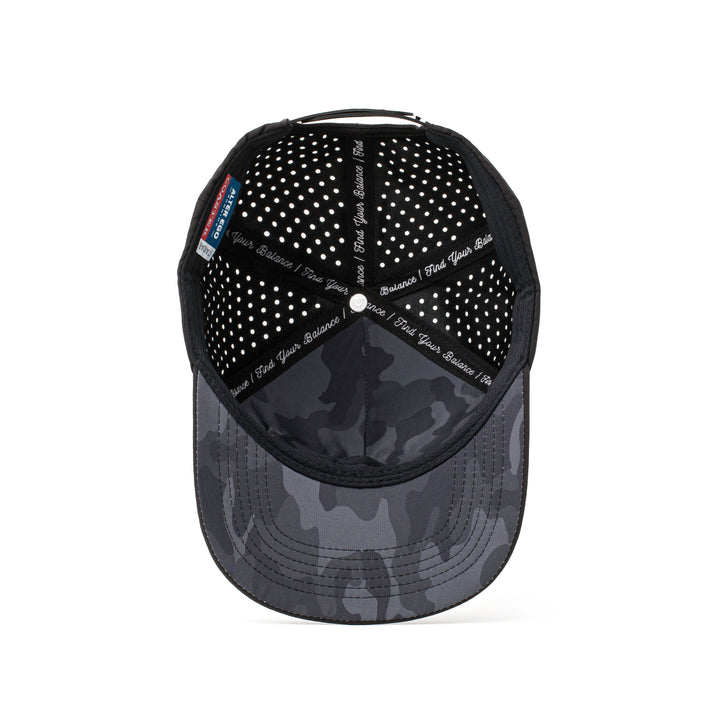 Interior and back view of a black performance cap with a dark camo-patterned mesh, adjustable strap, and perforated details for maximum airflow and comfort.