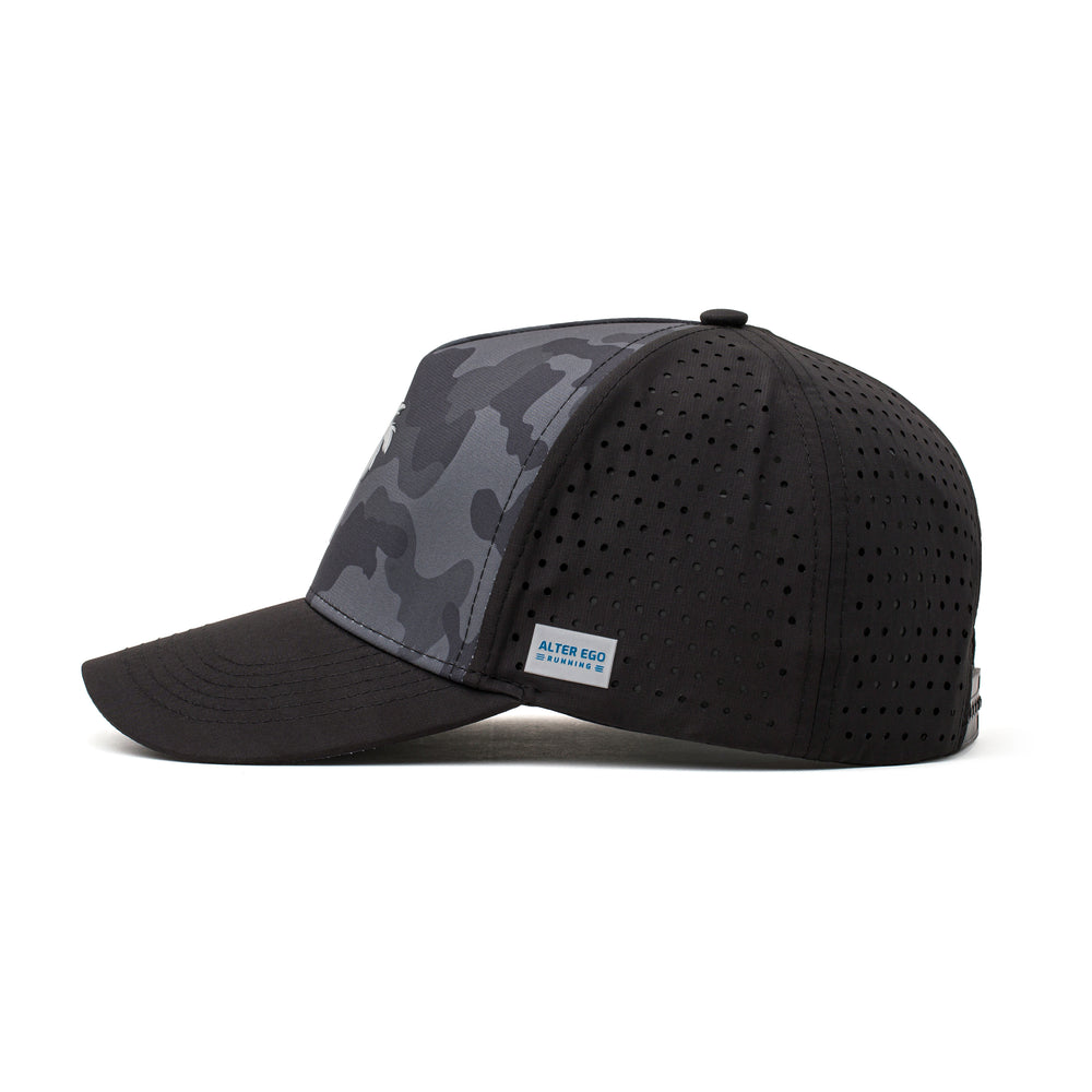 Side view of a black and camo hat featuring a white palm tree emblem, lightweight fabric, and a curved brim for comfortable outdoor activities.