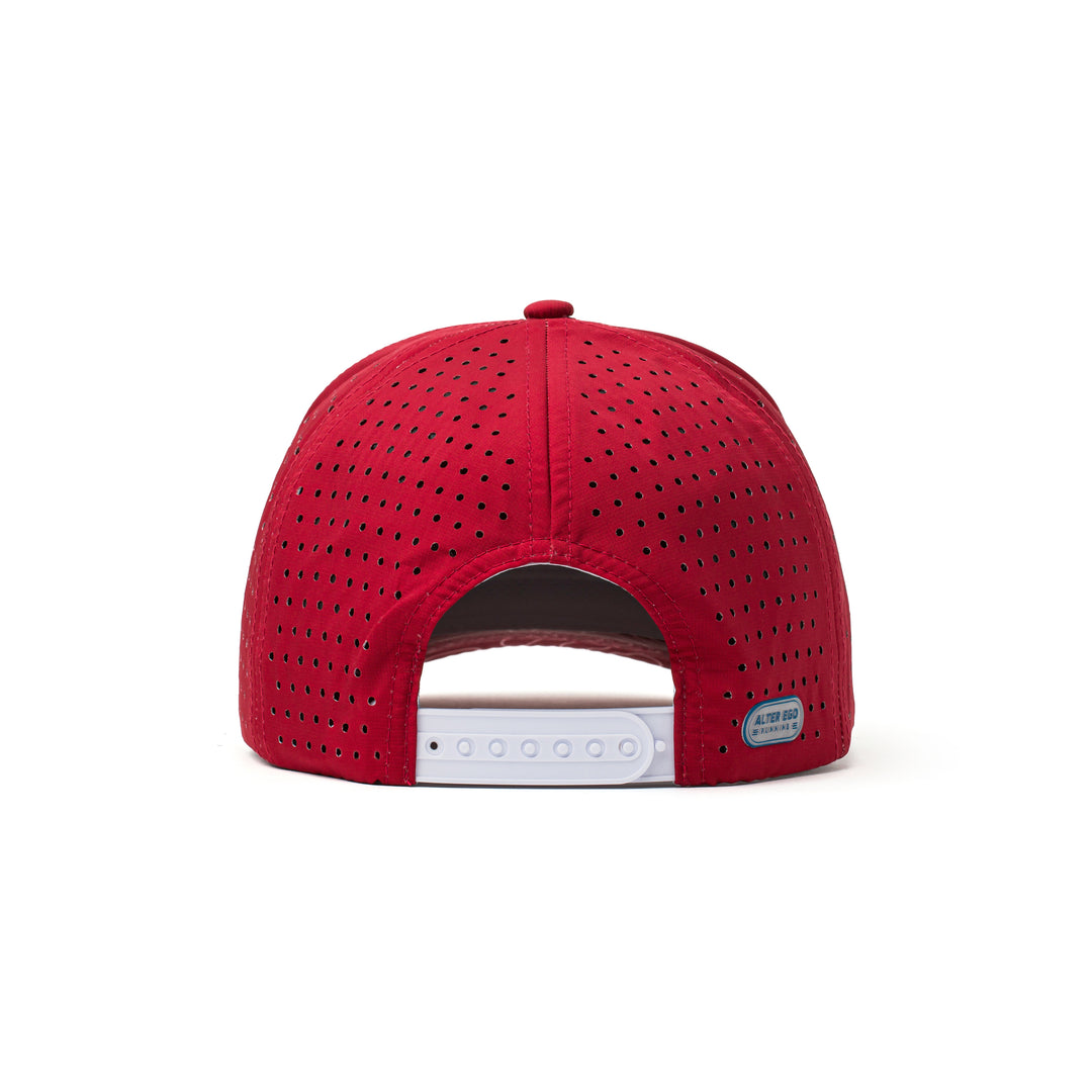 Back view of a red performance cap with an adjustable strap and a patterned red mesh panel, offering ventilation and a secure fit.