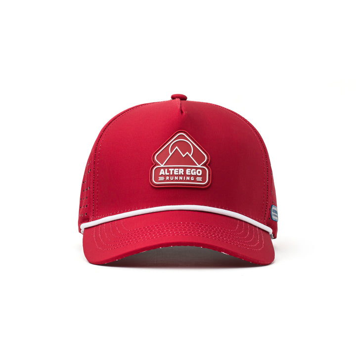 Front view of a red athletic hat with a bold white mountain logo, structured design, and water-repellent fabric for active lifestyles.
